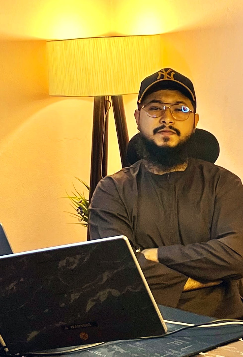 Zubaer Hossain at his desk